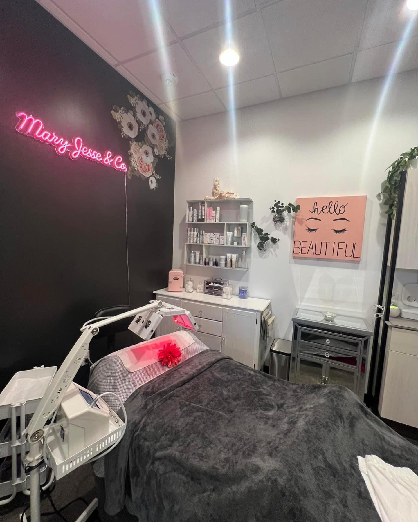 Mary Jesse Skin + Scalp Studio treatment room with neon sign